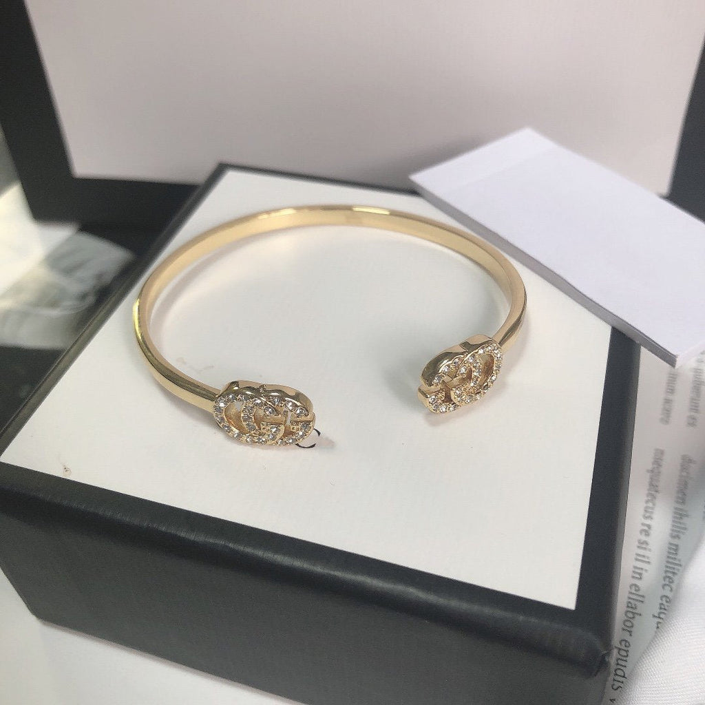 Gucci Gold Running Cubic Zirconia Logo Bangle Bracelets