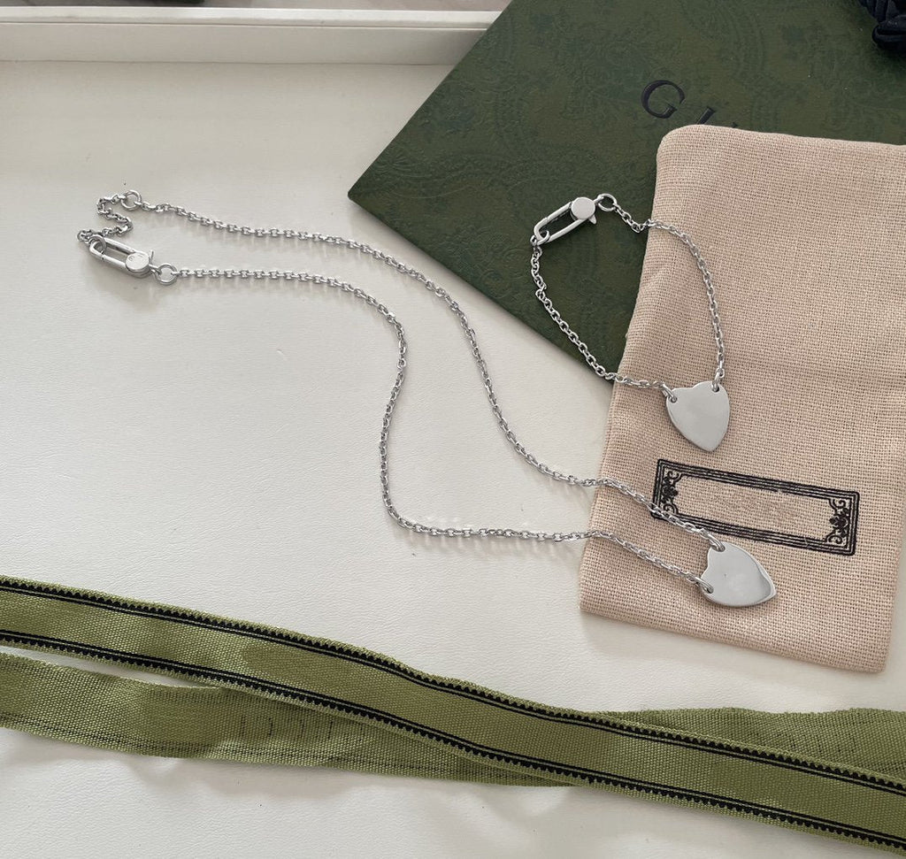 Gucci GG Logo Heart-Shaped Pendant Silver Bracelet