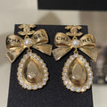 Chanel Gold Bow Pearl Letter Carved Double C Teardrop Crystal Earrings